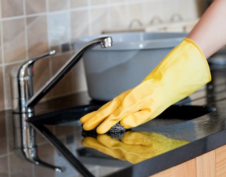 Cleaner preparing a carpet cleaning appointment in a modern UK property