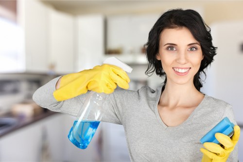 Staff member applying careful carpet cleaning methods in a commercial setting