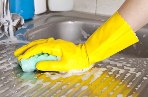 Detailed post-construction cleaning of kitchen surfaces in a Canary Wharf property